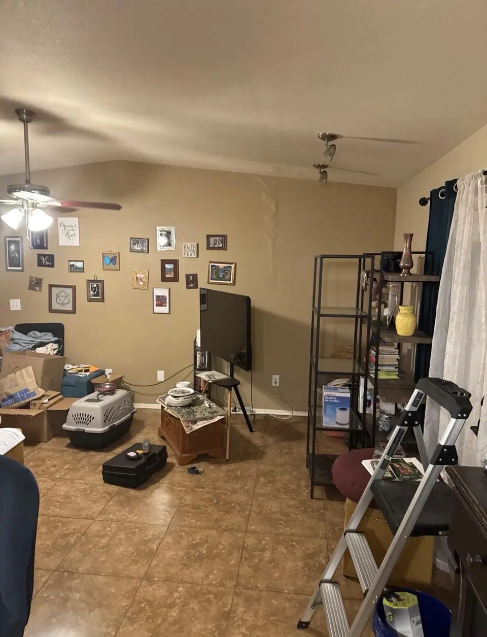 Water tracking down a living room wall from a leak above